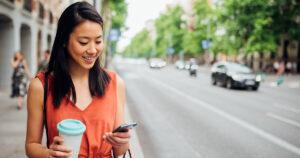 Asian woman checking her phone