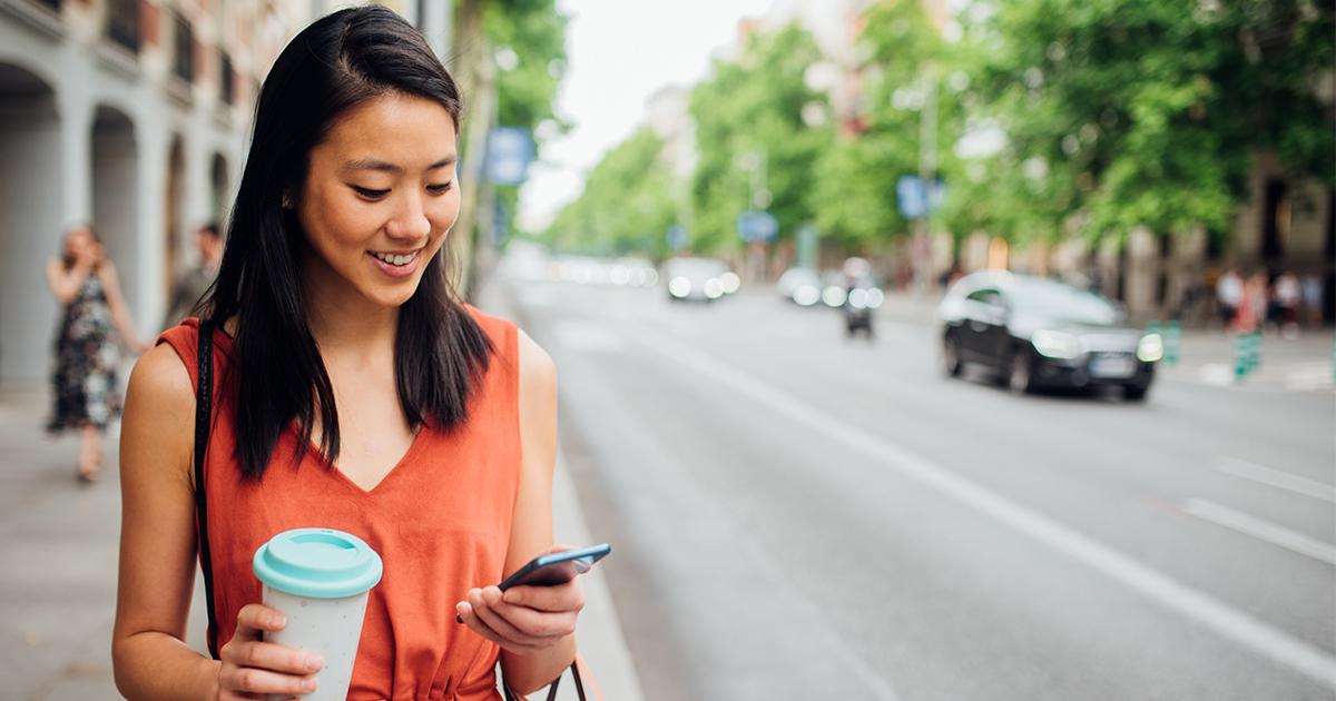 Asian woman checking her phone